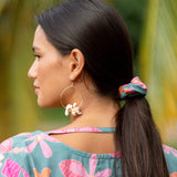 woman wearing scrunchie in floral pattern