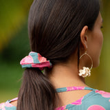 woman wearing scrunchie in floral pattern
