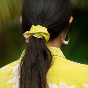 woman wearing scrunchie in bright orchid pattern