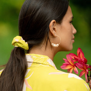 woman wearing scrunchie in bright orchid pattern