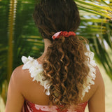 woman wearing red scrunchie with pink ginger print