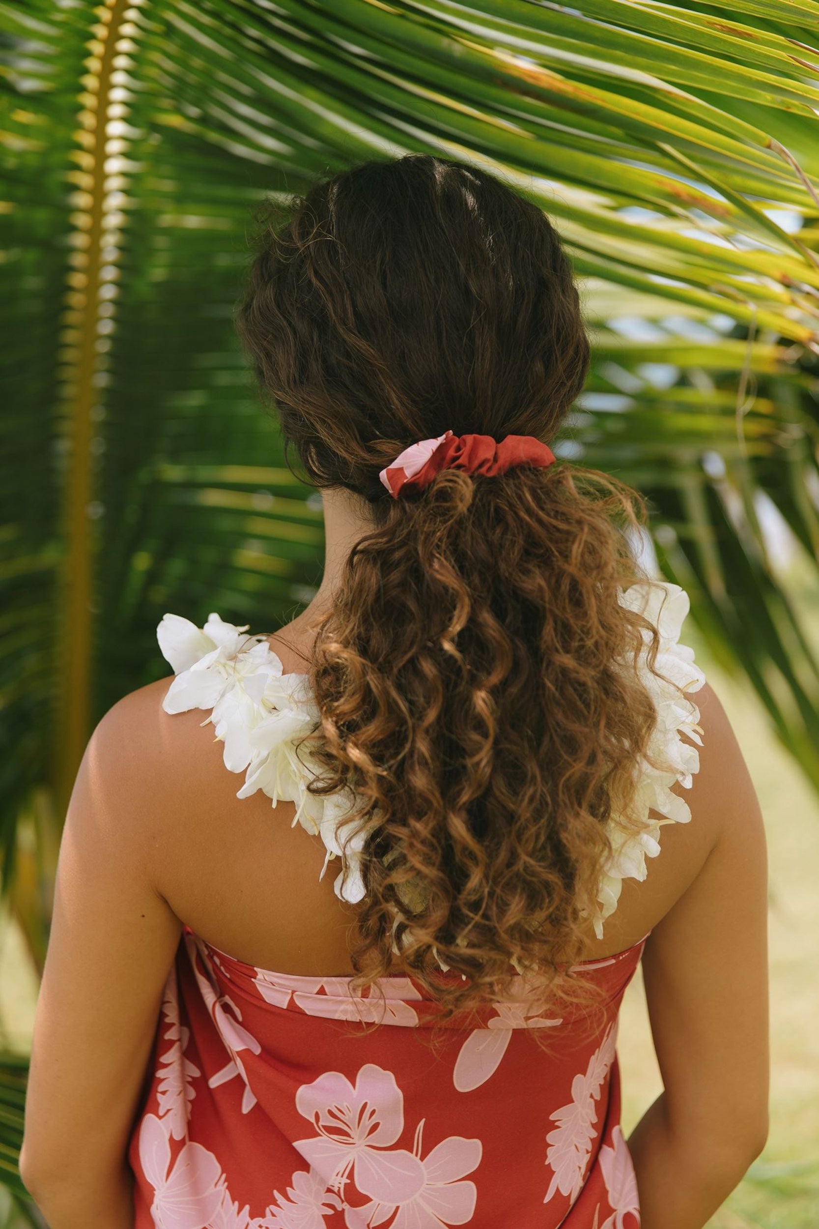 woman wearing red scrunchie with pink ginger print