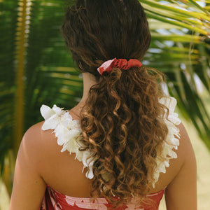 woman wearing red scrunchie with pink ginger print