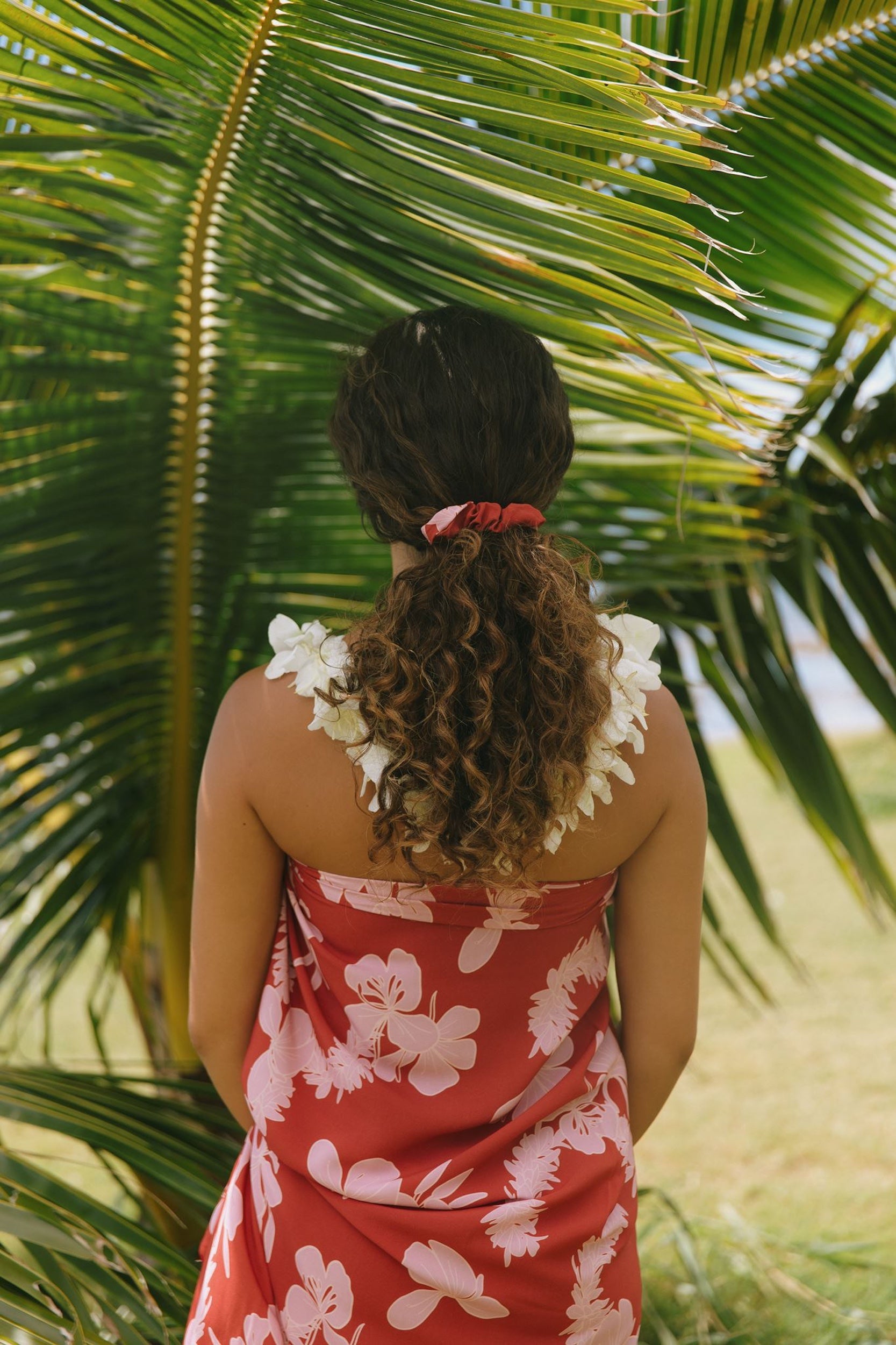 woman wearing red scrunchie with pink ginger print