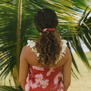 woman wearing red scrunchie with pink ginger print