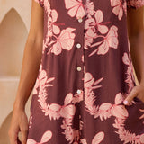 woman with brown hair wearing brown/maroon toned button up romper with pink lei awapuhi print