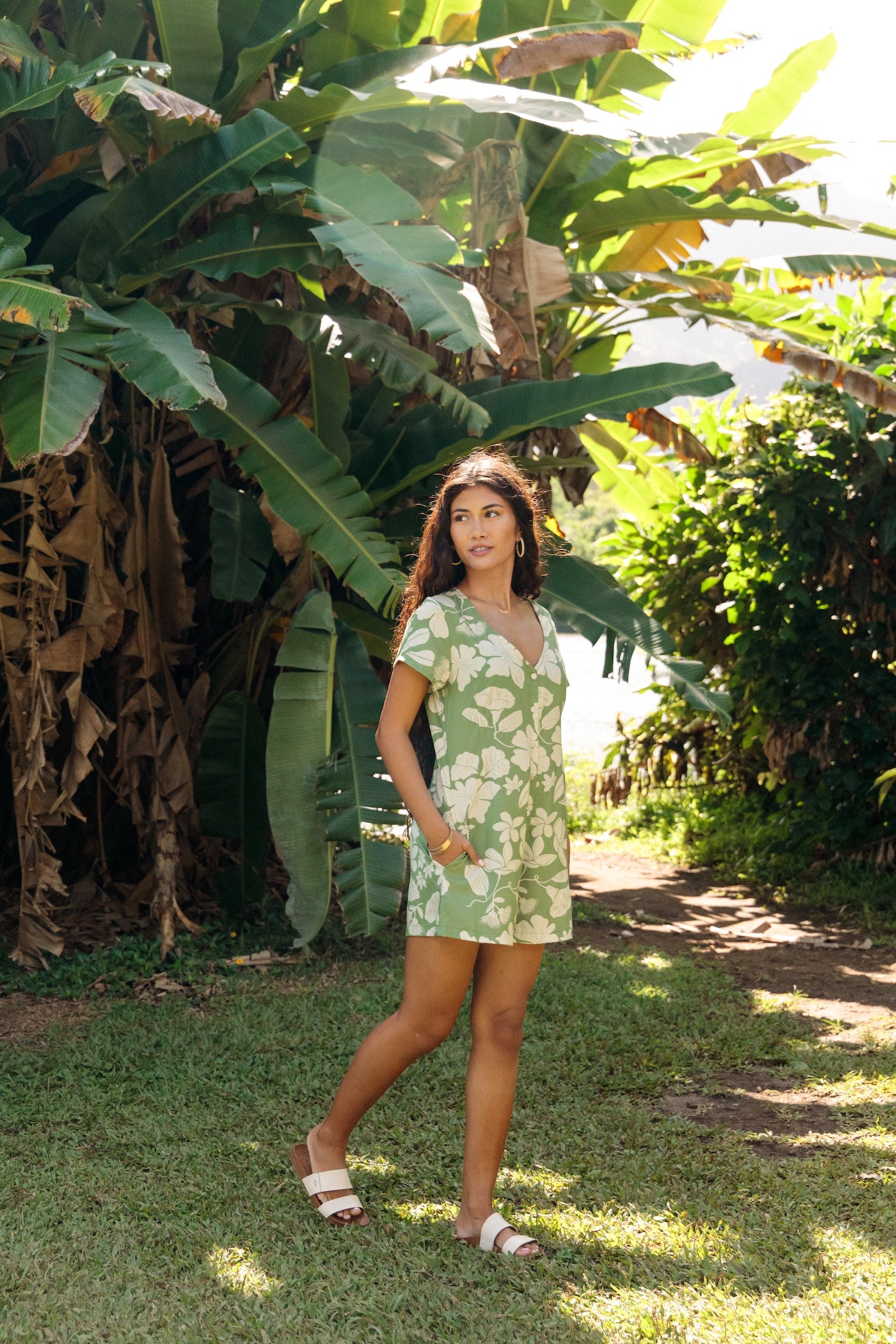 woman wearing green romper with native Hawaiian plants