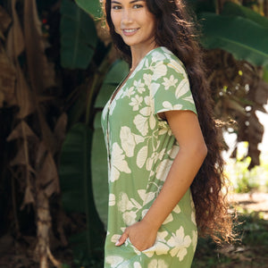woman wearing green romper with native Hawaiian plants