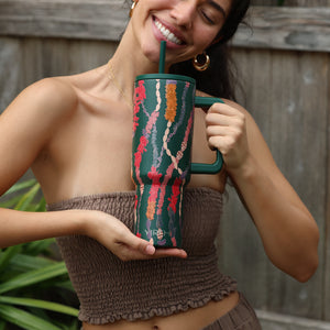 green tumbler with shell lei print