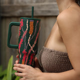 green tumbler with shell lei print