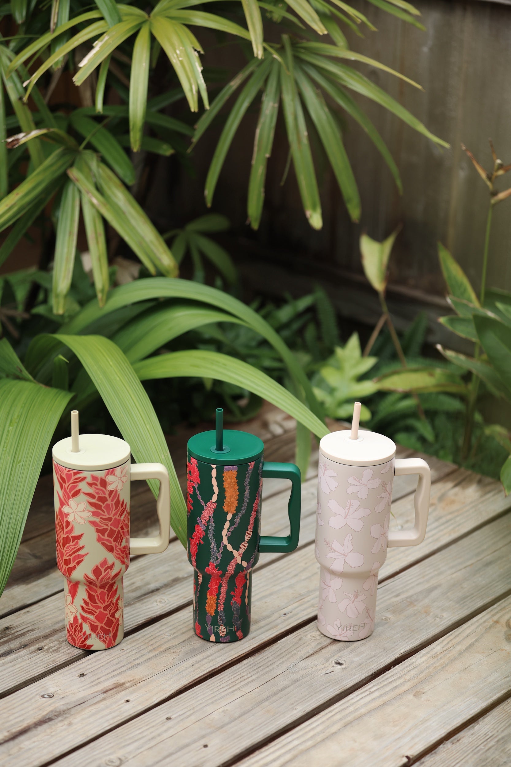 green tumbler with shell lei print