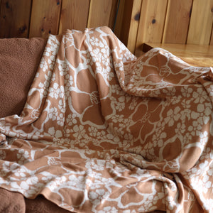 woven cotton blanket in pua paina tan