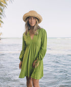 The Yireh Aster Dress in basil. Romantic and feminine silhouette. This is a classic Yireh style featuring flowing sleeves with a tie at the wrist and a zipper closure in back. Part of our limited run of solids, perfect to transition from day to night. Ethically and sustainably made resort wear.