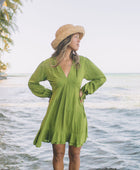 The Yireh Aster Dress in basil. Romantic and feminine silhouette. This is a classic Yireh style featuring flowing sleeves with a tie at the wrist and a zipper closure in back. Part of our limited run of solids, perfect to transition from day to night. Ethically and sustainably made resort wear.