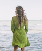 The Yireh Aster Dress in basil. Romantic and feminine silhouette. This is a classic Yireh style featuring flowing sleeves with a tie at the wrist and a zipper closure in back. Part of our limited run of solids, perfect to transition from day to night. Ethically and sustainably made resort wear.