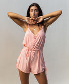 YIREH Hudson Romper in Peach - a flirty romper with covered buttons, adjustable straps, and a tie belt. Versatile resortwear ethically and sustainably made with exclusive and one of a kind prints.