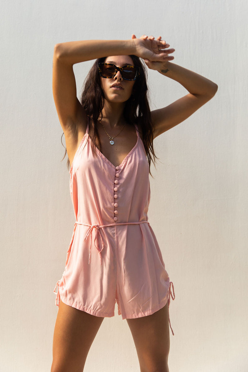 YIREH Hudson Romper in Peach - a flirty romper with covered buttons, adjustable straps, and a tie belt. Versatile resortwear ethically and sustainably made with exclusive and one of a kind prints.
