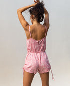 YIREH Hudson Romper in Petal - a flirty romper with covered buttons, adjustable straps, and a tie belt. Versatile resortwear ethically and sustainably made with exclusive and one of a kind prints.